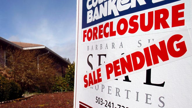 Sale Pending Foreclosure sign in front of house